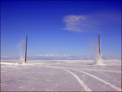 Blasting power poles out of the ice