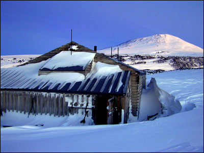 Hut at Cape Evans with Mt. Erebus behind