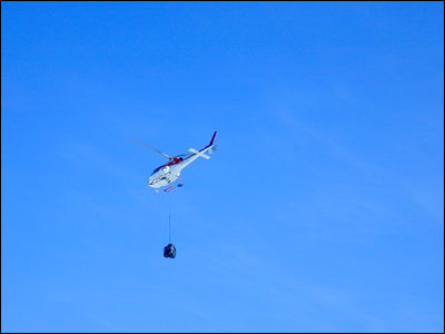 Helicopter with sling load at Marble Point